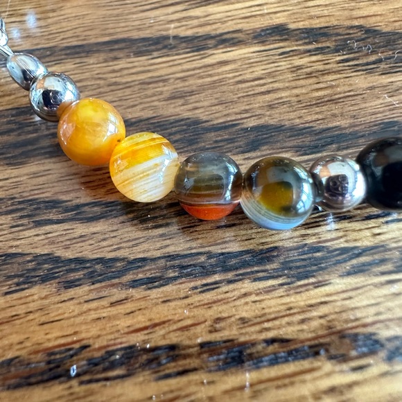 Handcrafted bracelet made with bumblebee agate and sterling silver charms. - Picture 4 of 4